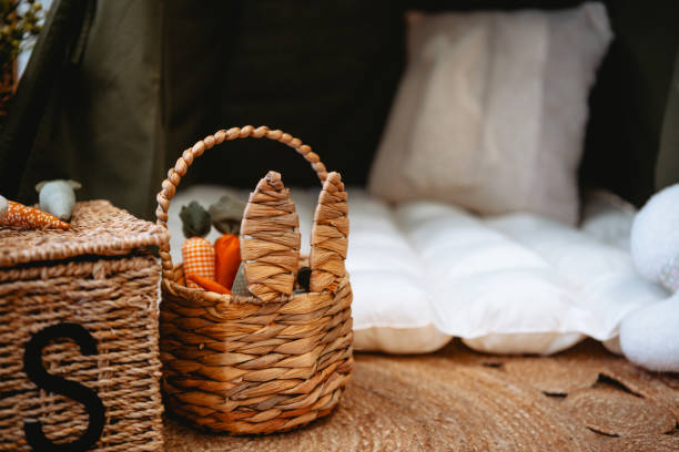 istock Cozy camping setup with woven basket and soft bedding in nature 2199248962