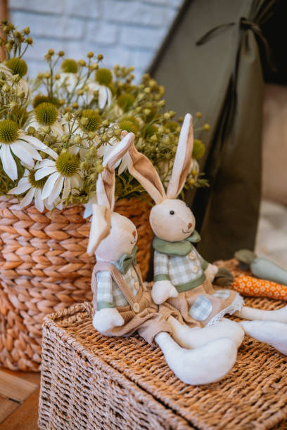 istock Decorative bunnies and flowers in a cozy indoor setting during spring 2199249062