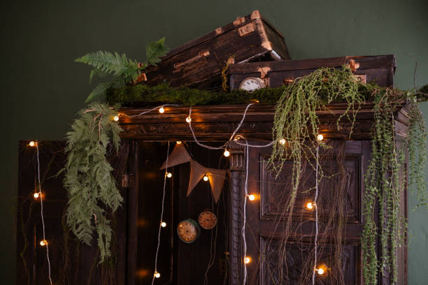 istock Vintage cabinet with greenery and warm lights in a cozy room 2199249214