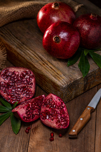 Pomegranate on Wood Block Background