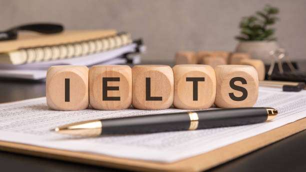 istock wooden blocks spelling IELTS on a desk with documents, a pen, and study materials 2199272492