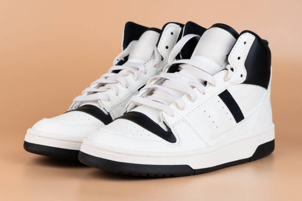 istock Sleek high-top sneakers designed with white and black color scheme 2199272495