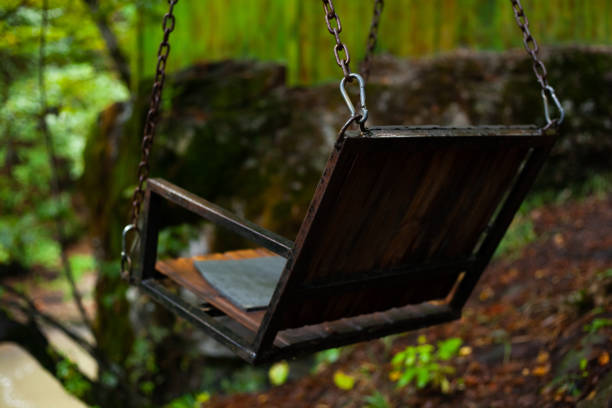 vintage swing in the forest on a chain