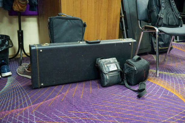 Black leather guitar case and other cases
