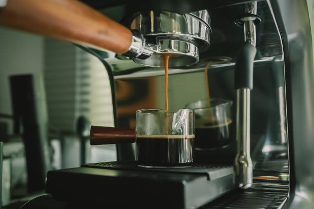 istock coffee flows from the medium machine, brewing a perfect roast with smooth crema and aromatic depth. A true coffee lover moment. 2199275401