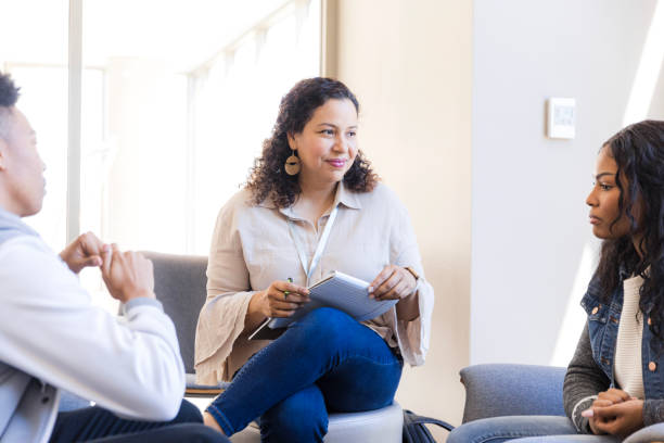 istock Group Therapy Session: Diverse Adults Discussing Mental Health 2199275754