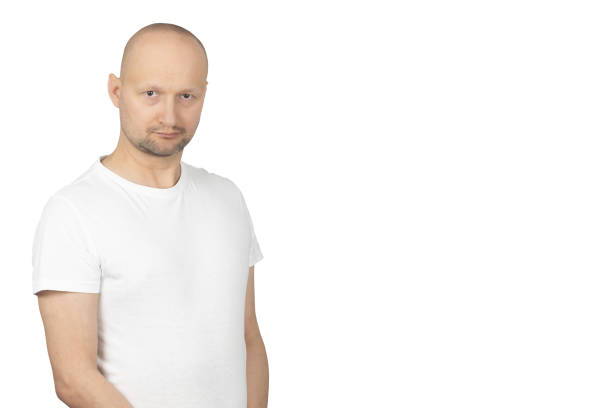 istock Serious man in white t-shirt looking directly at the camera 2199278736