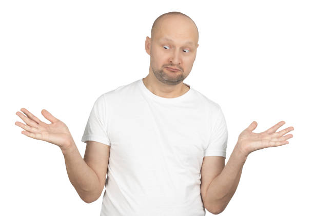 istock Confused man in white t-shirt shrugging with a puzzled expression 2199279162