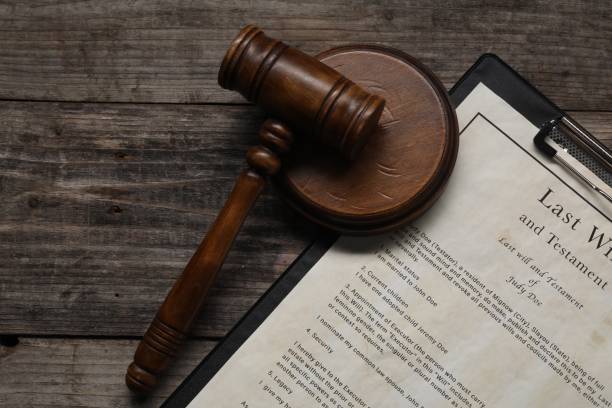 istock Last Will and Testament with gavel on wooden table, top view. Space for text 2199281026