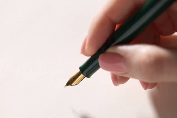 istock Woman writing with fountain pen, closeup. Space for text 2199281028