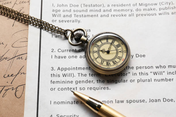 istock Last Will and Testament with pocket watch and pen, closeup 2199281030