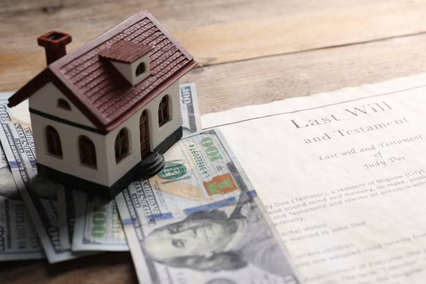 istock Last Will and Testament, house model and dollar bills on wooden table, closeup 2199281032