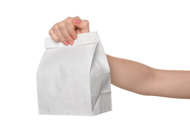 istock Woman holding paper bag on white background, closeup 2199281074