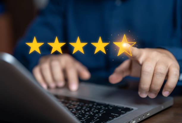 istock Businessman touching glowing yellow five stars for excellent evaluation after customer use product service. Customer review: good rating concept. feedback and positive customer reviews. 2199285563