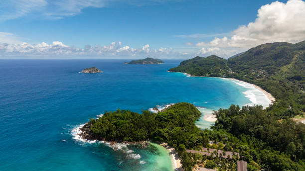 istock Isolated tropical island with lush greenery surrounded by turquoise waters. Seychelles, Mahe. 2199286550