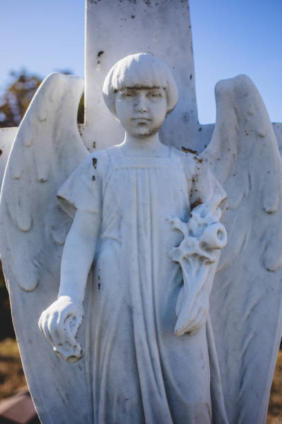 Weathered old angel statue in a cemetery in Germany
