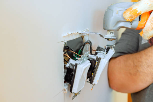 istock Home renovation activity highlighting an electrician working on a wall socket installation in a residential setting 2199291259
