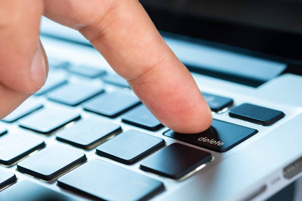 istock Finger of the computer user, he presses the delete button on the computer keyboard. 2199291308