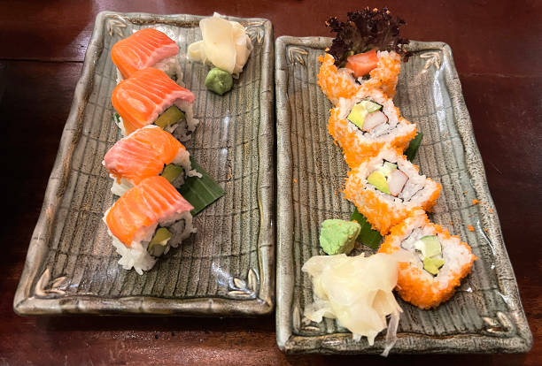 Salmon wrapped around rice with imitation crab and tobiko filling, served with rolls wrapped in tobiko, imitation crab, tamago, cucumber, and cream cheese.