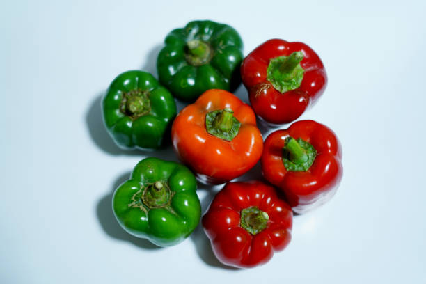 fresh red and green bell peppers. closeup