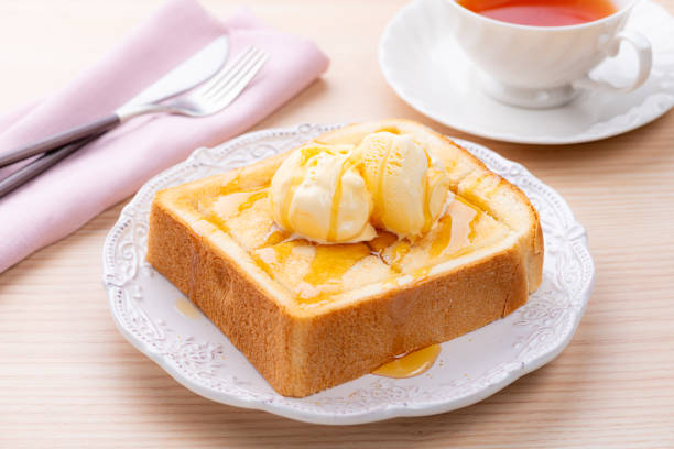 Honey Toast with Vanilla Ice Cream and Tea on a Table