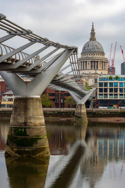 istock St. Paul's cathedral and Millennium bridge over Thames river, London, UK 2199301248