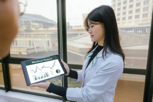 istock Health Insights: Doctor and Patient Collaboration in the Corridor 2199303226