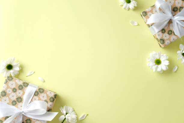 istock Flat lay composition with gift boxes and chamomile flowers on green background. Happy Mother's Day, birthday, International women's Day 8 march concept 2199303402