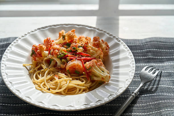 homemade spaghetti, cooked with tomato sauce and cauliflower