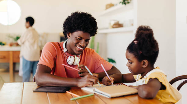 istock Happy kids learning and creating together at home 2199305670