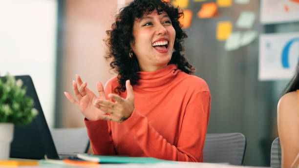 istock Excited Latin Employee Celebrating Team Success and Work Achievements 2199315899