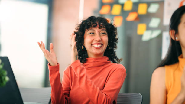 Excited Employee Celebrating Team Success and Work Achievements