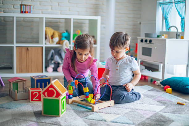 istock Children playing with educational toys in kids room 2199318183