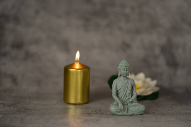 Buddha in the ambience with candlelight and atmospheric lighting