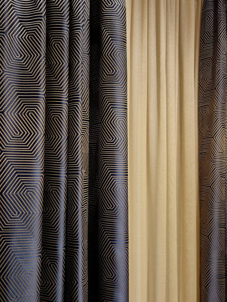 istock a curtain on a stainless steel console with a light-impermeable fabric and a soft curtain with white color. dark blue brocade with a geometric pattern and yellow mottled 2199321653