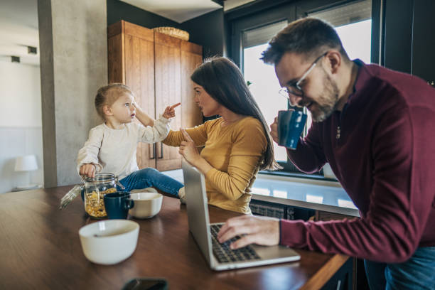 istock Parents working from home while taking care of their daughter 2199321923