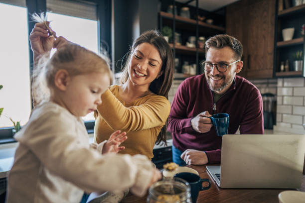 istock Family enjoying morning routine in kitchen 2199321930