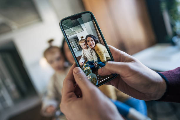 istock Capturing joyful family moments with smartphone 2199322114