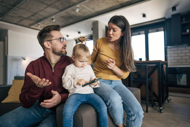 istock Parents arguing about their daughter using a smartphone at home 2199323896