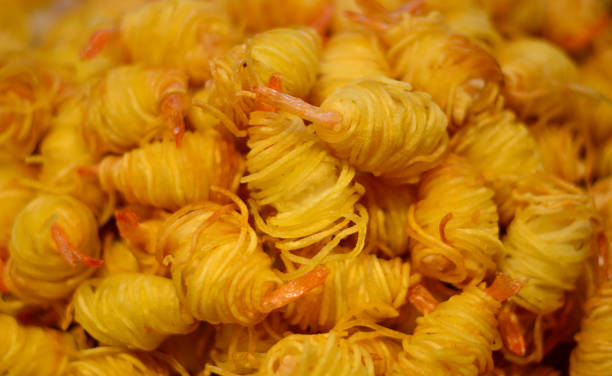 istock scent and delicate taste pan-fried shrimp with potato lace 2199324714