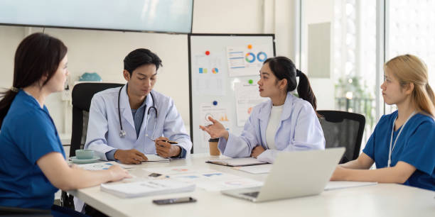 istock Medical team analyzing patient data and discussing treatment plans in a meeting. 2199325102