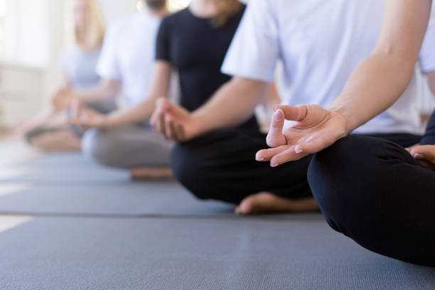 Women practicing yoga outdoors