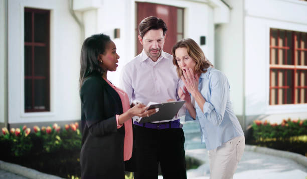 istock Debtor speaks with bailiff about property confiscation 2199327400