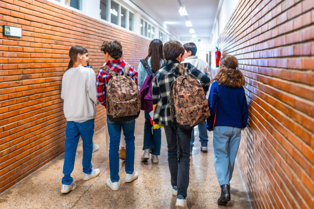 istock Group of students walking in school hallway 2199328166
