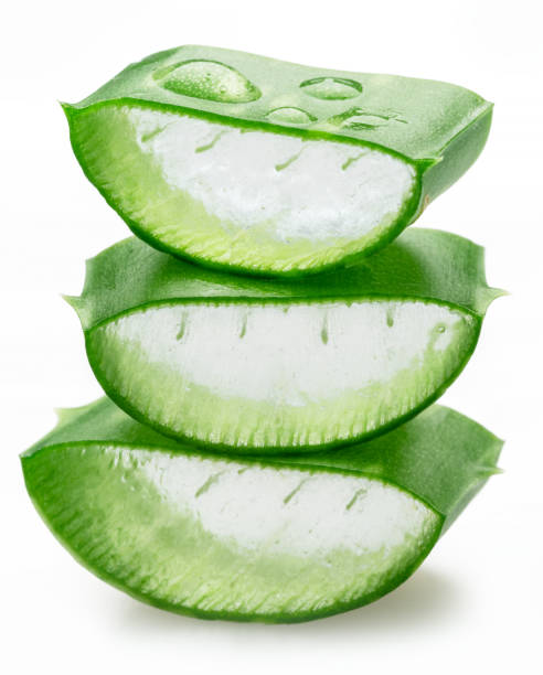istock Stack of three aloe vera slices or cuts of aloe, macro shot isolated on white background. 2199328492
