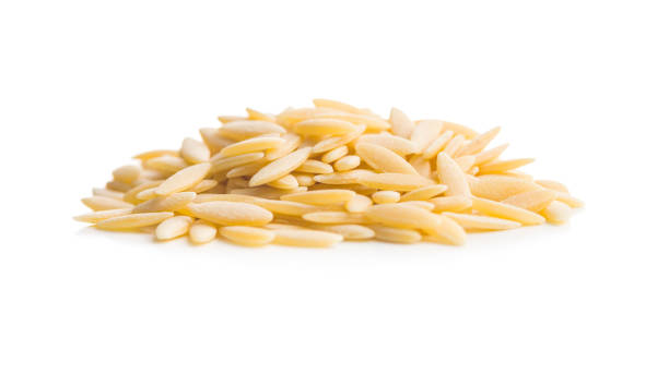 istock Orzo, kritharaki, risoni pasta. Uncooked dry pasta isolated on white background. 2199330063