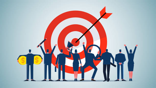 istock Team success and achievement, accomplishing team goals, teamwork, a group of businessmen standing in front of a bull's-eye shot by an arrow 2199333590