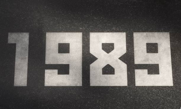 istock Black granite slab with white numbers 1989 on it 2199340101