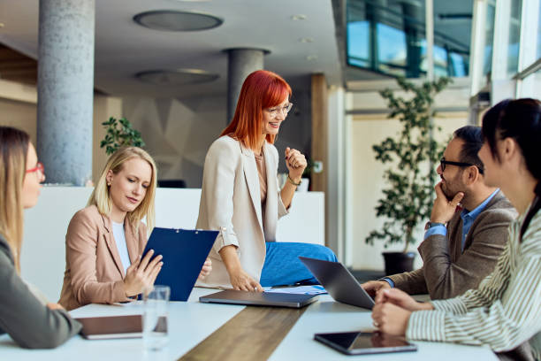 istock Collaborative Business Team Engages in a Productive Modern Office Meeting 2199340125