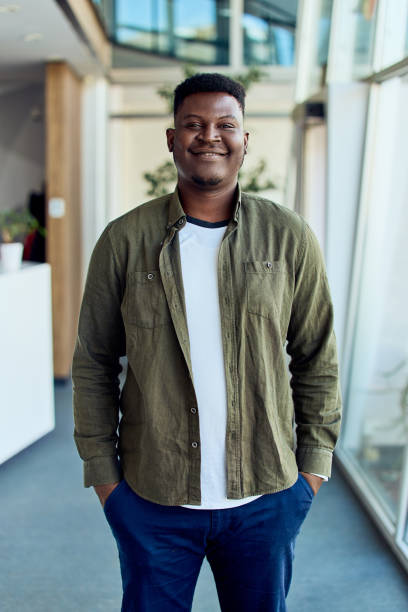 istock Confident Smiling Person Poses Casually in a Bright and Modern Environment 2199340141